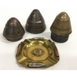 Three shell heads and tench art ashtray with Ypres badge