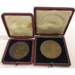 A pair of boxed brass coronation medal for the 1902 coronation of Edward VII the largest being