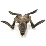 An unusual devils/rams wooden mask decorated in brass and copper 43x35x19cm.