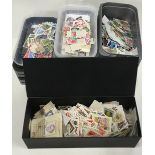 large quantity of world stamps to sort