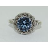 large Blue stone surrounded by blue stones silver ring size N