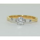 A 18ct yellow gold three stone diamond ring, Size P, approx weight: 2.9g, approx. diamond weight 0.