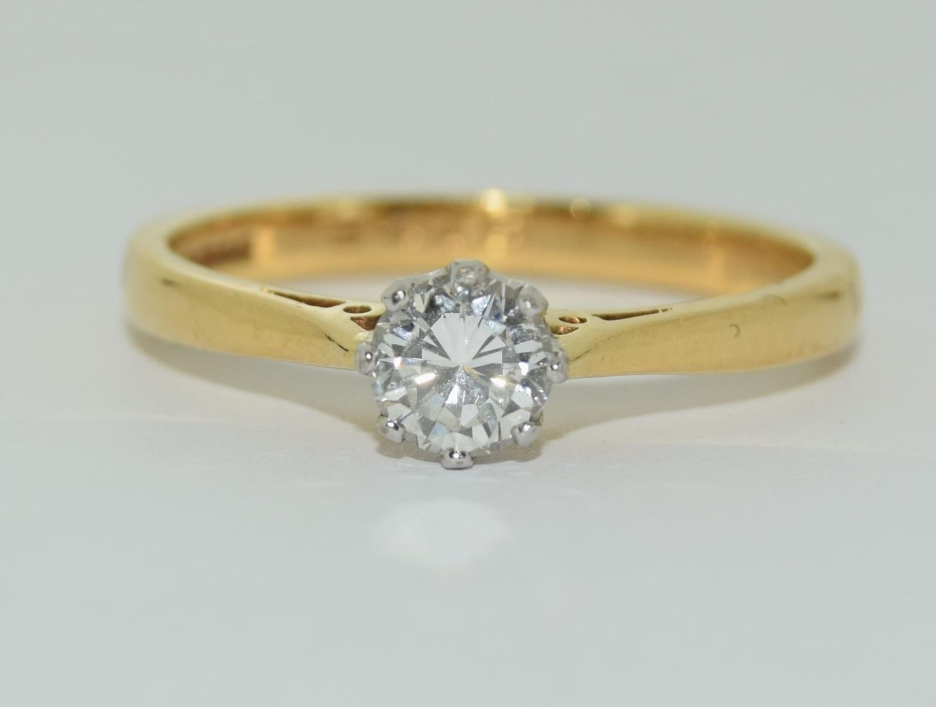 An 18ct yellow gold solitaire ring of 2.8gm of 0.39ct brilliant cut diamond size N.