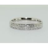 A Palladium diamond half eternity ring showing two rows of diamonds total weight 0.4ct size O.