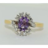 18ct yellow gold diamond and amethyst cluster ring. Approx weight 3.5gms. Diamond cut: Brilliant,