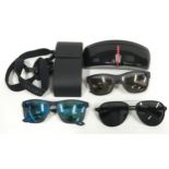 3 pairs of Prada sunglasses, 2 Prada sunglasses cases and 2 straps. Ref X385.