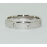 An 18ct white gold diamond set wedding ring approx. weight 3.6gm, Diamond cut Brilliant, Size M