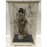 Vintage model of a Geisha girl housed in a glazed painted metal framed cabinet. Overall height of