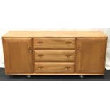 Ercol Golden Dawn "Windsor" sideboard, 3 central draws one with fitted cutlery compartment with