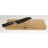 Quality Kamikoto Santoku 7" chef's knife. Appears unused in wooden presentation box with certificate