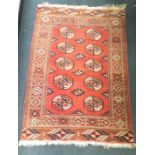 Vintage Bokhara rug, base colour red. Approx 5' x 3'9"