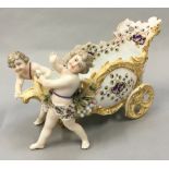 Late 18th/early 19th century continental porcelain figure of cherubs pulling a flower basket. No