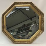 Octagonal gilt framed bevelled edged mirror.