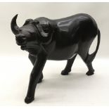 Large solid wood carved figure of a water buffalo 38cm across x 28cm tall