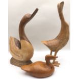 Large carved wooden figures of two geese and a duck. Largest figure is 49cm tall