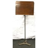 Brass base adjustable height music/bookstand , with wooden upper standing on a triangular shape base