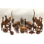 Large collection of carved wood animals and figures to include buffalo, camels, sheep and rabbits.