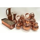 Collection of antique copper pieces to include milk jugs.