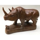 Large solid wood hand carved Rhinoceros and calf on plinth 29cm across x 20cm tall