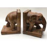 Pair of carved wood bookends in the form of an elephant 20cm tall