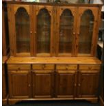 Ducal pine 2 part dresser having 4 glass doors over ,4 draws and 4 cupboards all with adjustable