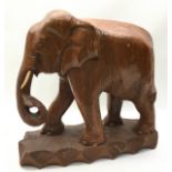 Large solid wood carved figure of an elephant 40cm across x 37cm tall.