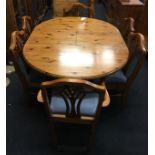 Ducal pine table together with 6 chairs to include carvers the table is adjustable in length