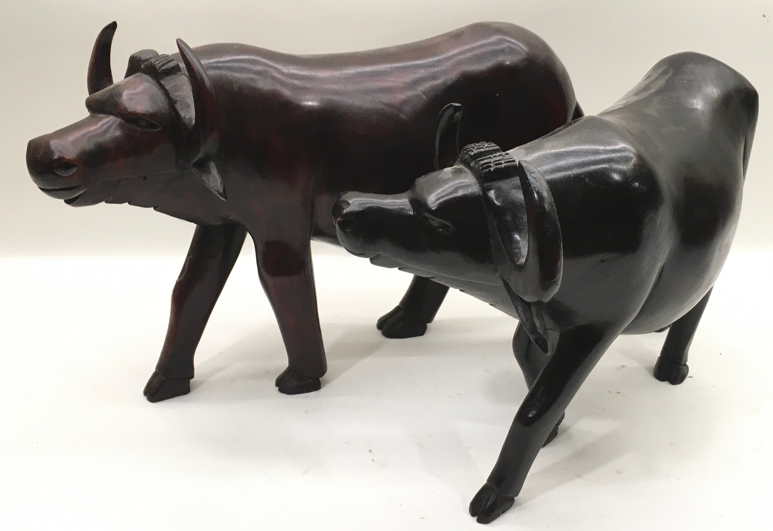 Very large pair of carved wood water buffalo the largest being 46cm across x 32cm tall - Image 2 of 4