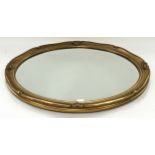 Contemporary gilt framed oval bevelled edged wall mirror 57x47cm.