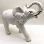 Large ceramic white elephant with gilded detail. Approx 50cm across x 42cm tall