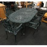 Cast metal garden table and 6 chairs the oval table with under shelf is 70x160x90cm ,chairs are