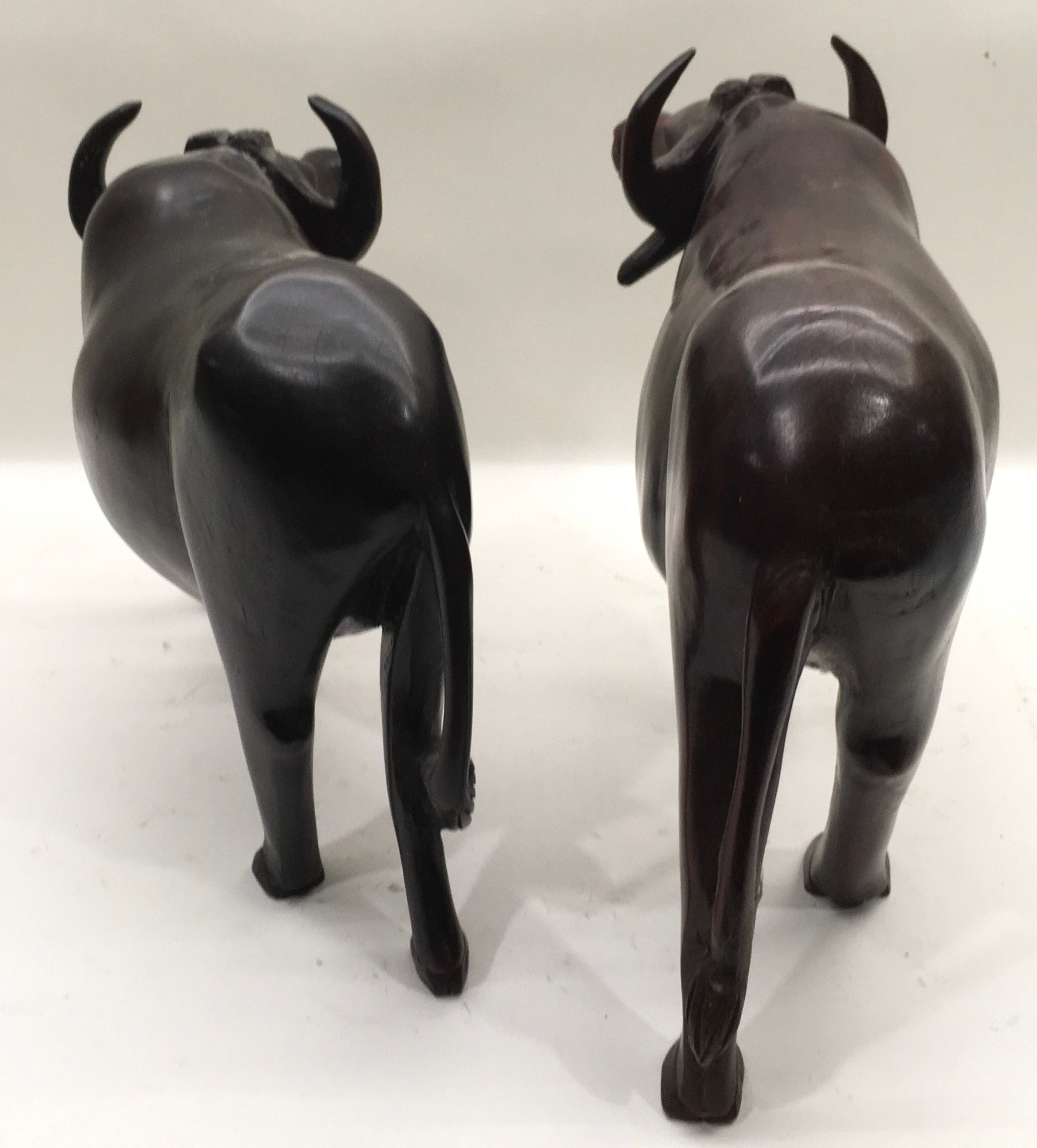 Very large pair of carved wood water buffalo the largest being 46cm across x 32cm tall - Image 3 of 4