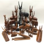 Large collection of carved wood antelopes and gazelle, the largest being 43cm tall. 19 pieces in all