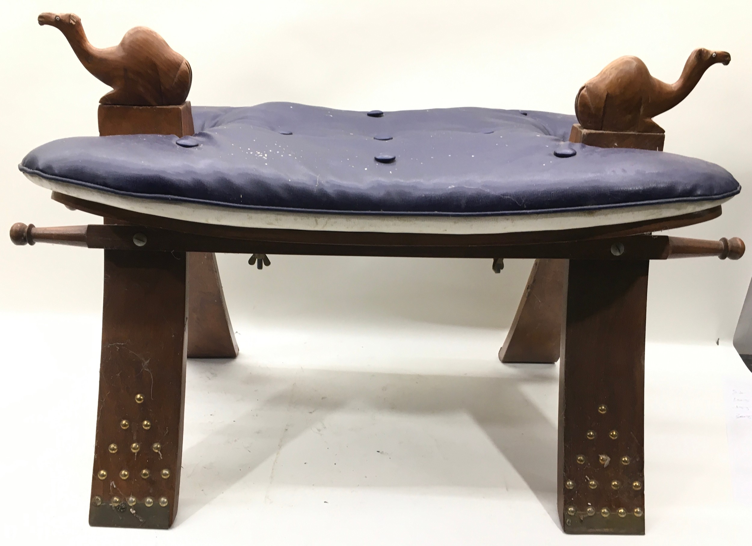 Vintage large Arabian / Middle Eastern Camel Stool. Wooden base with brass studded decoration and