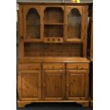 Ducal pine 2 part dresser having 2 glass doors to the upper over 3 draws and 3 cupboards below all