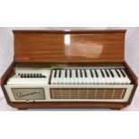 PIANORGAN. This unit was made by Farfisa and has a carrying handle but missing its legs.