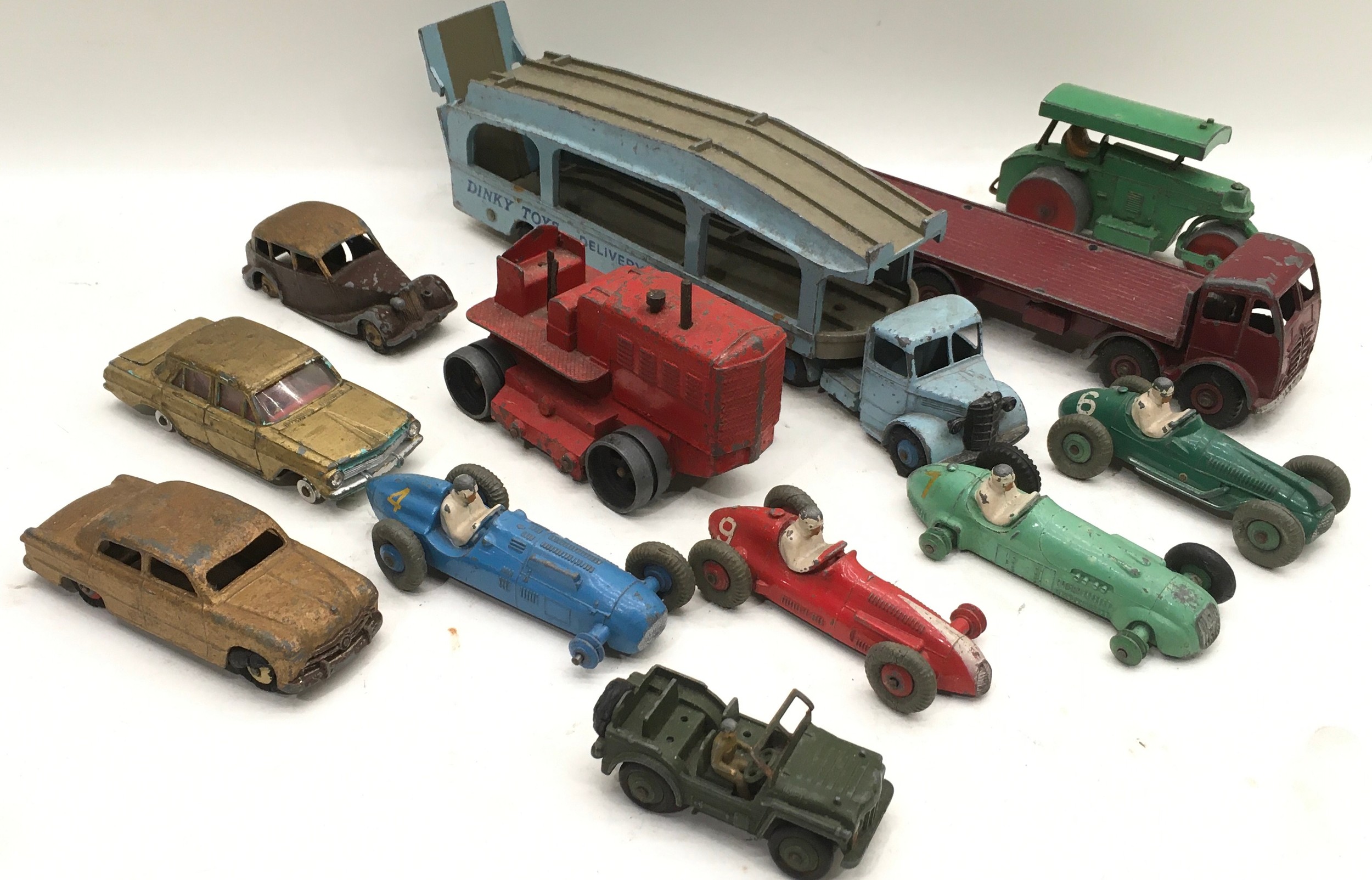 Box of early play worn mixed Dinky cars
