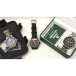 Three various gents wristwatches to include a boxed Swiss Military chronograph, a military style