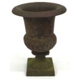Antique cast iron decorative urn 24cm tall 18cm diameter at widest spot.