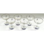 A set of six Babycham (white deer) advertising drinking glasses.