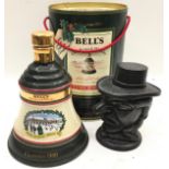 Mixed lot to include a ful sealed bottle of Bells Whisky in a Wade decanter dated 1989, and a