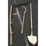 Two antique wooden handled scythes together with a shovel and a meat cleaver.