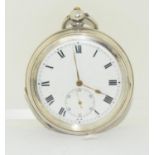 Large silver pocket watch with key.
