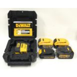 Four DeWalt batteries and a boxed DeWalt laser level (ref 160,161)