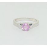 A 925 silver ring with with pink stone to centre, Size Q