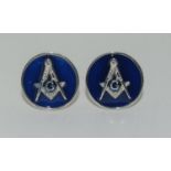 A pair of silver and enamel masonic style cufflinks.