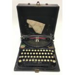 An early 1920's antique Remington typewriter in original case.