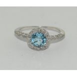 9ct Gold blue topaz and diamond ring K 1/2.