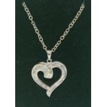 A 14ct white gold hearts shape pendant necklace set with diamonds