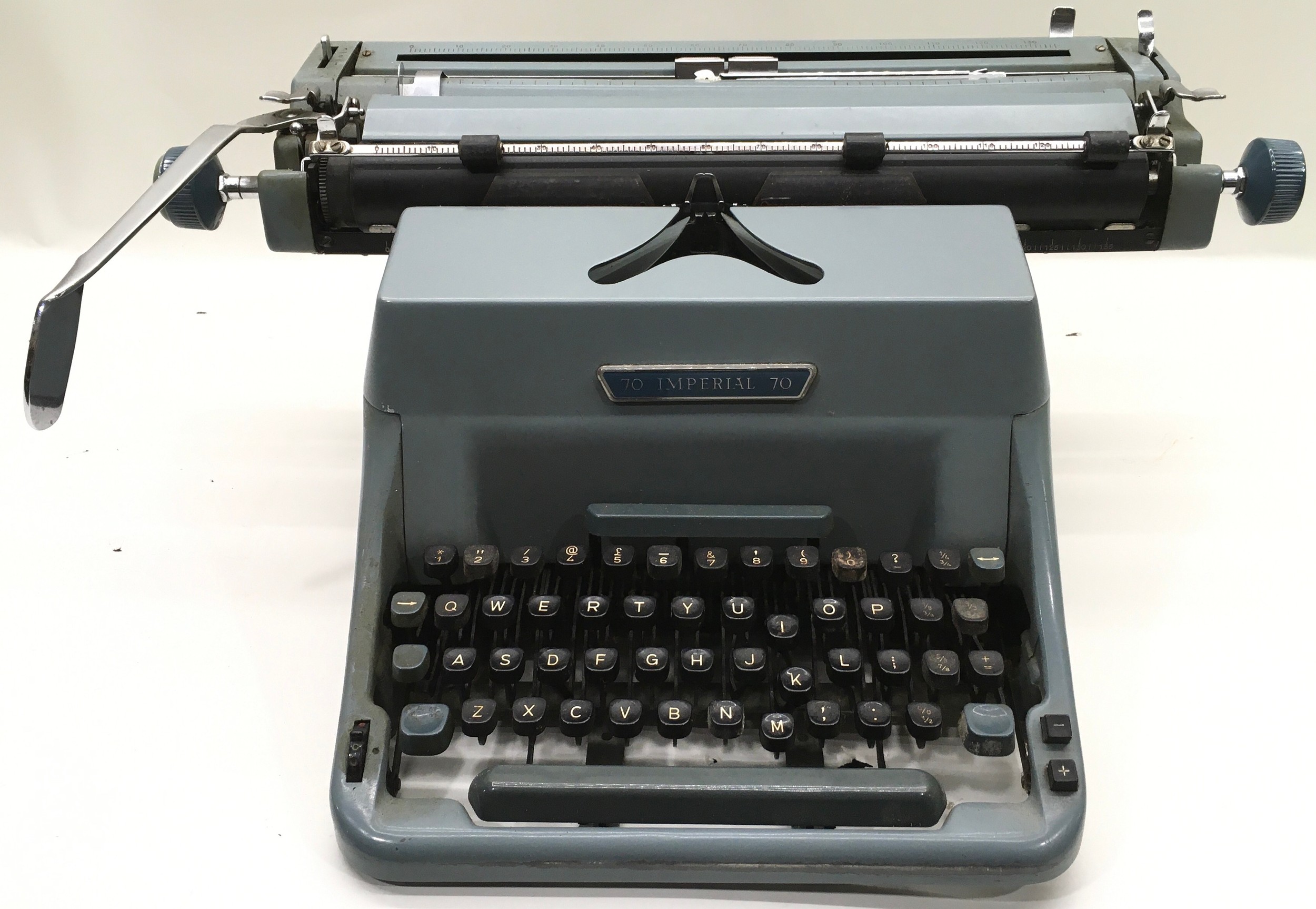 Vintage Imperial blue typewriter with cover.